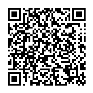 身上一件很普通的美军两栖作战背心被弹匣和各种装备填得满满当当二维码生成